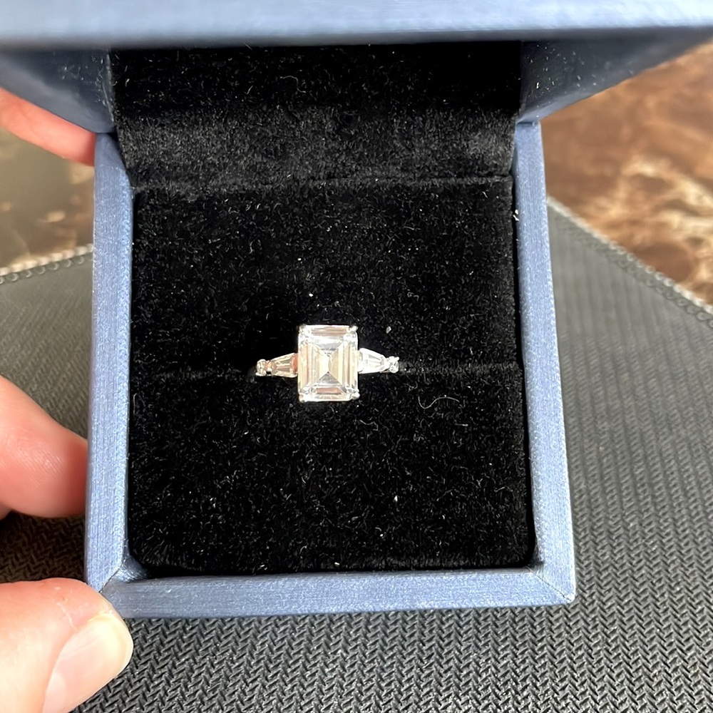 Emerald cut white sapphire in sterling silver.
